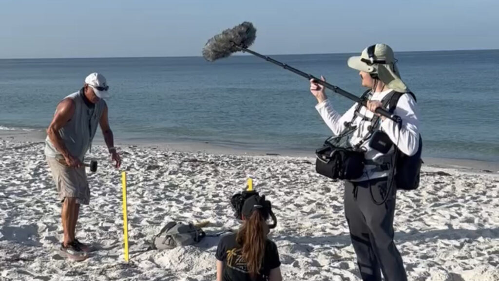 Behind the scenes of a documentary about environmental stewardship shot at the beach.